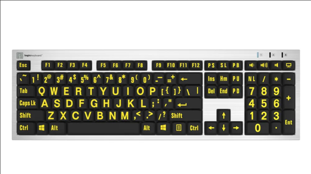 Teclado Slimline de color amarillo sobre negro plateado con letra grande